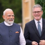 PM Modi shaking hands with UK PM Keir Starmer during India UK diplomatic visit 2025 in Mumbai.
